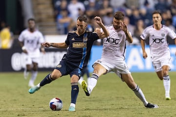 Daniel Gazdag battles for the ball against D.C. United midfielder Mateusz Klich at Subaru Park.