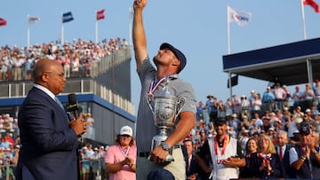 Bryson DeChambeau of the United States celebrates with the trophy as he is interviewed by NBC sportscaster Mike Tirico after winning the 124th U.S. Open at Pinehurst Resort on June 16, 2024 in Pinehurst, North Carolina.